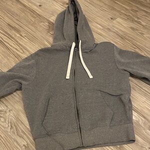 1x Woman’s Gray Zip-Up Hoodie with White Drawstrings
